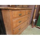 An early 20th century satinwood chest of two short over two long drawers