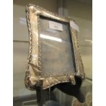 A white metal framed photo frame