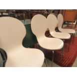A set of four modern chrome seated white painted bentwood style chairs
