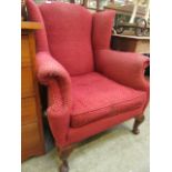 An early 20th century wing back chair