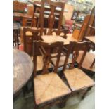 A set of four oak and ash seagrass seated dining chairs