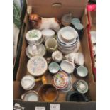A tray of assorted ceramic ware to include mugs, cups, saucers, model of a dog,