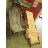 Two wooden reclining garden chairs with striped fabric