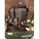 A box containing cameras, binoculars,