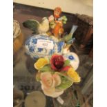 A selection of ceramic ware to include birds, posies, figurines,