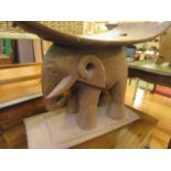 An African hardwood stool in the form of an elephant