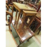 A mid-20th century walnut occasional table together with a similar nest of two tables