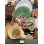 A tray containing large blue and white meat plate, leaf design plates, water jugs,