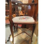 An Edwardian walnut framed corner tub chair