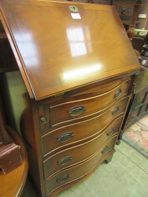 A reproduction fall front bureau having part fitted interior