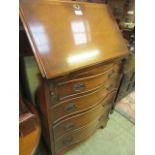 A reproduction fall front bureau having part fitted interior