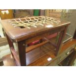 An eastern hardwood stool with leatherwork lattice seat