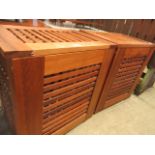 A pair of modern teak lattice effect linen baskets