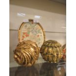 A pair of gilt painted balls together with a gilt framed petite pointe needle work of still life