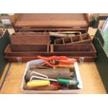 A carpenter's chest with an assortment of tools