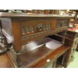 A reproduction oak center table having two drawers