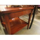 A reproduction mahogany two tier occasional table