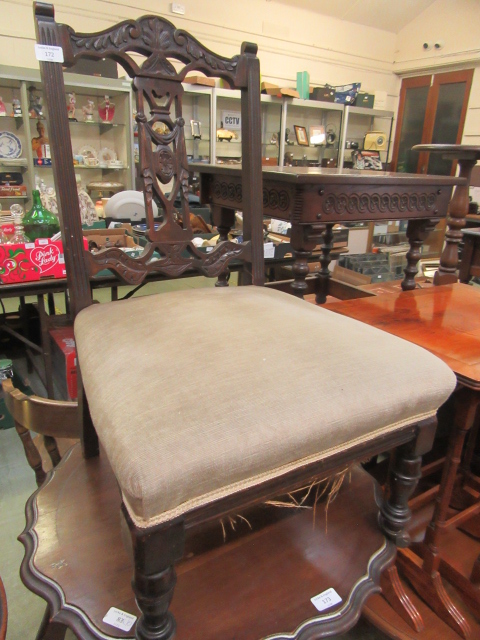 An Edwardian walnut framed nursing chair