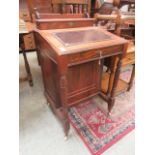 An Edwardian walnut davenport