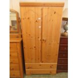 A modern pine two door wardrobe (A/F)