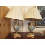 A pair of modern table lamps with urn columns