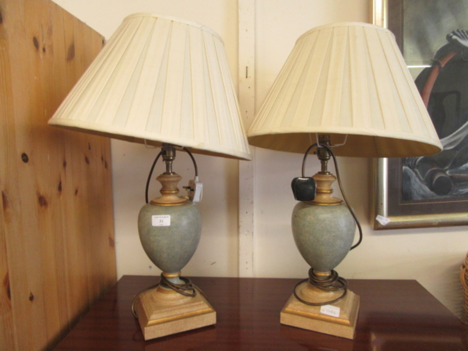 A pair of modern table lamps with urn columns