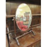 A mid-20th century swing toilet mirror