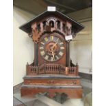 An early 20th century walnut and ebonised cuckoo mantle clock CONDITION REPORT: No