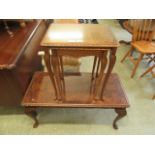 A mid-20th century walnut occasional table together with a similar nest of two tables