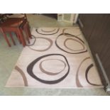 A modern beige ground rug