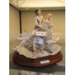 A continental ceramic figural group of lovers in boat