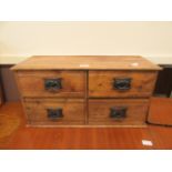 A reproduction waxed pine four drawer spice cabinet