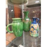 Three green glazed jugs