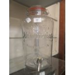 A large glass two gallon water dispenser