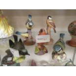 Five ceramic figures of birds to include Royal Worcester and Beswick