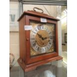 A reproduction mahogany cased mantle clock