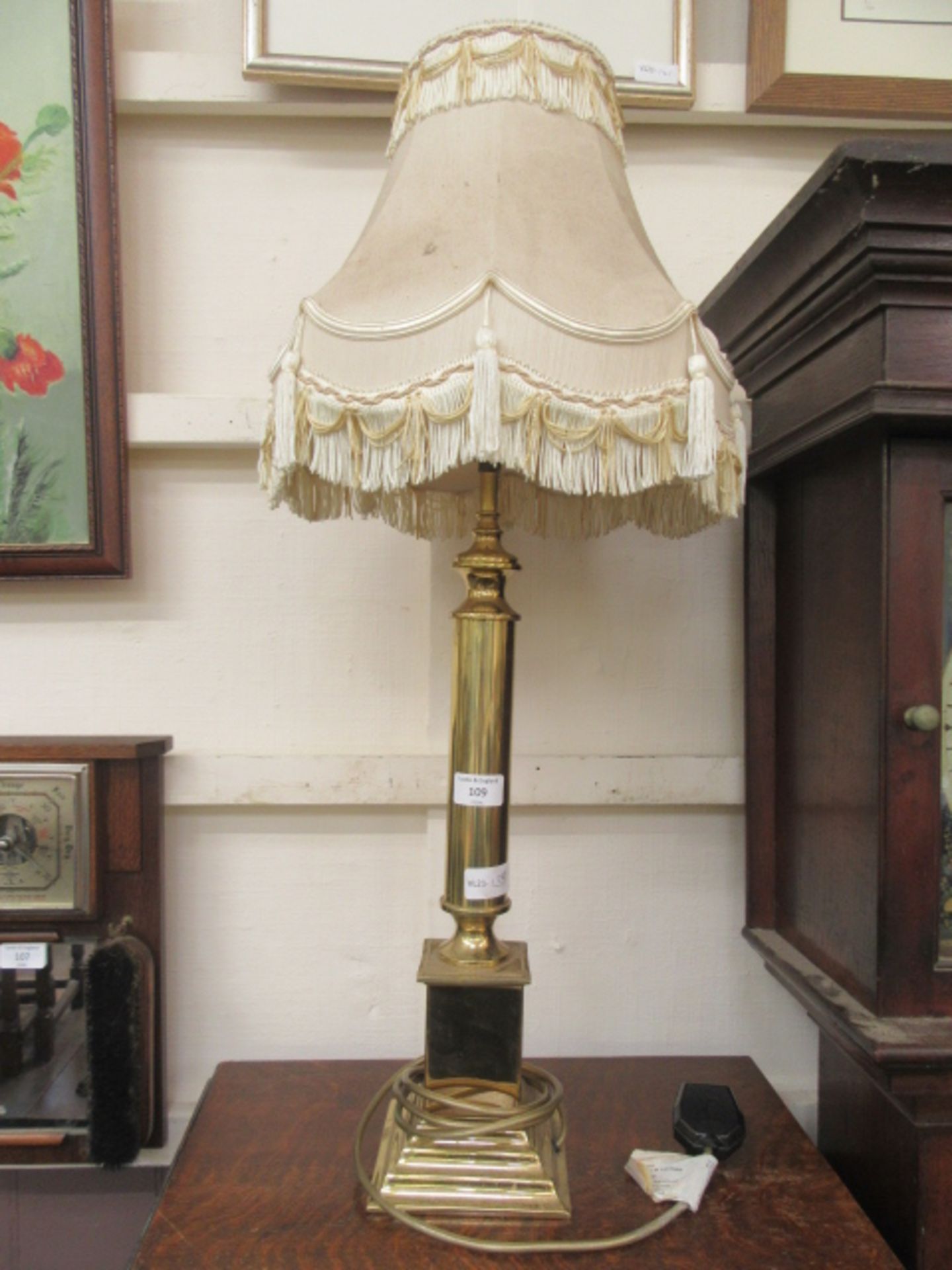 A brass columned table lamp