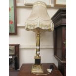 A brass columned table lamp