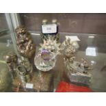 A selection of crystal glass figures, white metal ornaments,