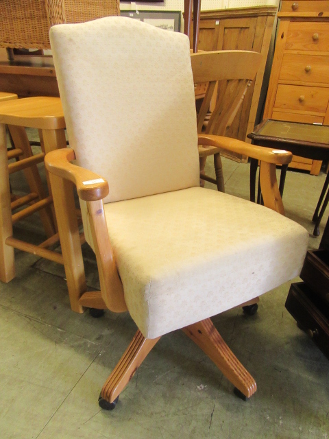 A modern pine framed swivel office chair