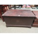 A wooden chest having a candle box and drawer