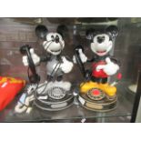 A pair of novelty telephones one of Mickie Mouse the other of Minnie Mouse