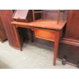 A mid-20th century oak desk with single drawer