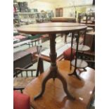 An oak pedestal top table