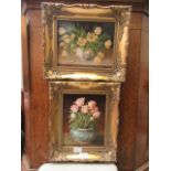 A pair of gilt framed prints of still life