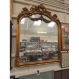 An ornate gilt framed over mantle mirror CONDITION REPORT: Dimensions as follows: