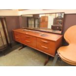 A mid-20th century teak dressing table having mirror to back,