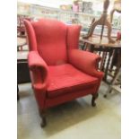 An early 20th century wing back chair