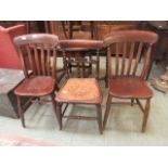 A pair of lath back dining chairs together with one other