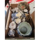 A tray containing blue and white ceramic ware along with other decorative ceramic ware